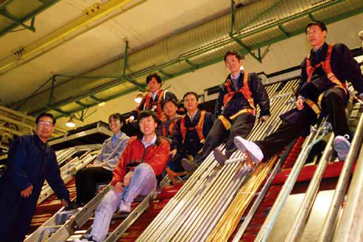 IHEP group members installing the trigger system of the L3+C detector at CERN
